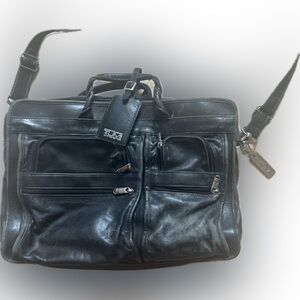 Tumi leather laptop briefcase. Chunky hardware, soft black quality leather.